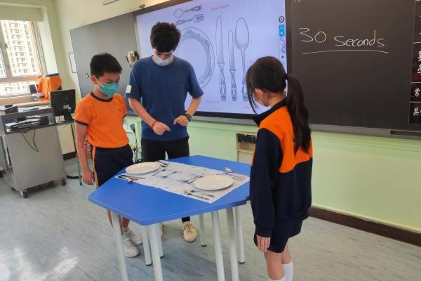 Students learn about the table manner in Europe.